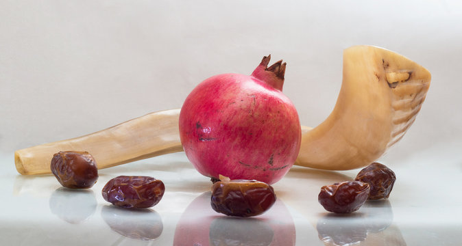 shofar  with a pomegranate and dates