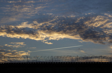 Fototapeta na wymiar Sunset outside a prison