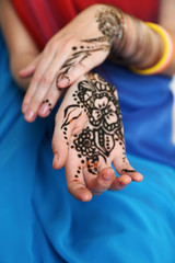 Image of henna on female hands, closeup