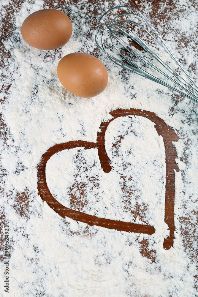 Sticker eggs and corolla on flour background