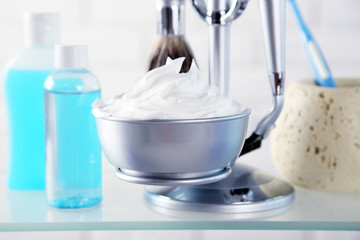 Male luxury shaving kit on shelf, on bricks wall background
