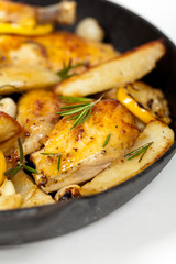 Frying Pan with Roasted chicken thighs. Selective focus.