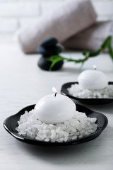 Composition of spa treatment on table, on white background