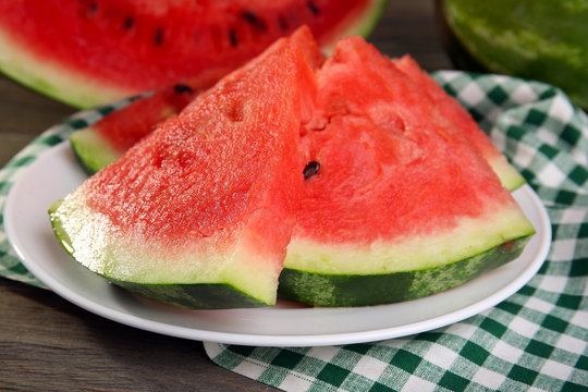 Slices of ripe watermelon on table close up