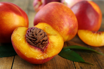 Fototapeta na wymiar Fresh peaches on wooden background