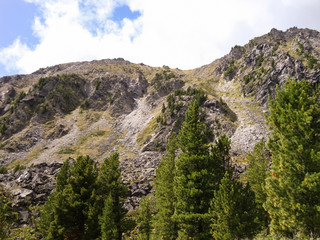 At the bottom of the hill.