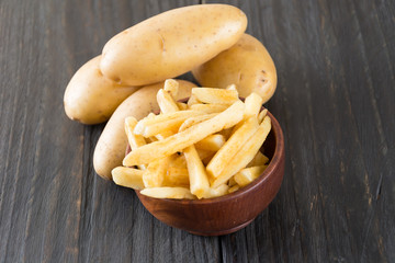 french fries on wood background