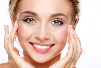 Fototapeta premium Young woman touching her face isolated on white background