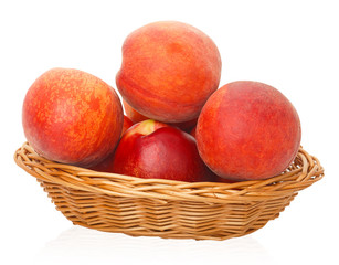 Ripe peaches in a wicker basket