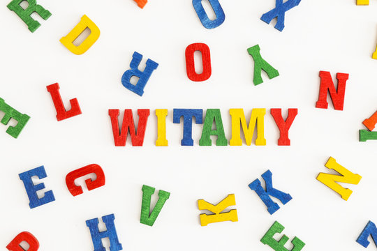 Series "Welcome": word Witamy (welcome in Polish) in wooden letters on white background
