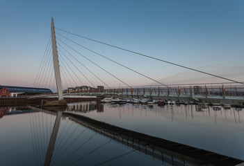 Fototapeta na wymiar The Millennium bridge, Swansea, also known as the Sail bridge.