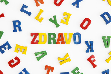Series "Hello": word Zdravo (hello in Serbian, Croatian, Slovene) in wooden letters on white background
