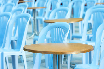 Fototapeta na wymiar Round table and chairs in outdoor cafe