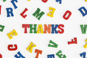 Series "Thank you": word thank you in English in wooden letters on white background
