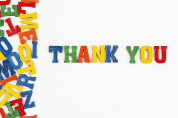 Series "Thank you": word thank you in English in wooden letters on white background
