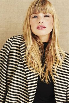 Beautiful blond woman in coat, portrait
