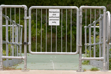 Navigators and authorised personnel only sign on gate leading to canal