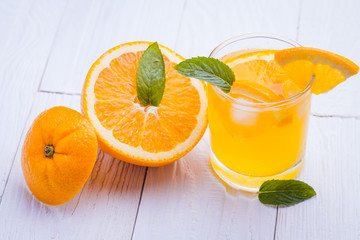 orange alcohol cocktail on a wooden table.