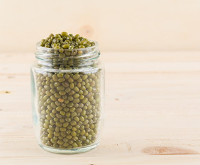 green beans on wood background