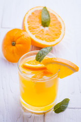 orange alcohol cocktail on a wooden table.