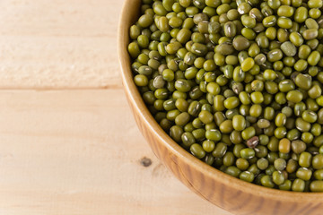 green beans on wood background