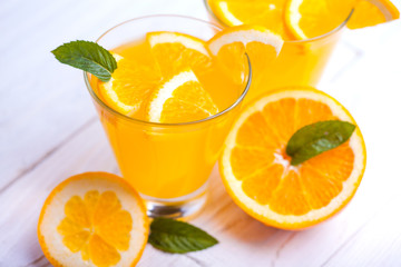 orange alcohol cocktail on a wooden table.