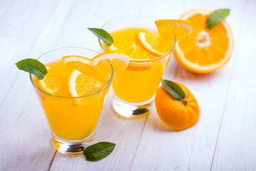 orange alcohol cocktail on a wooden table.