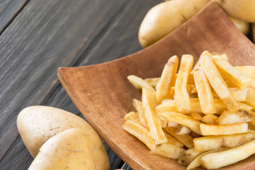 french fries on wood background