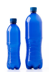 Bottles of soft drinks on white background