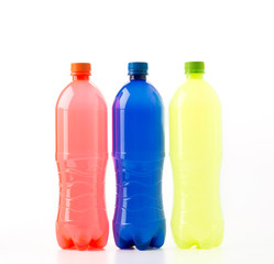 Bottles of soft drinks on white background