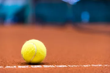 Tuinposter tennis ball on a clay court © meanmachine77