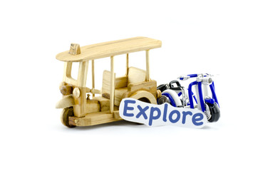 handcrafted tuk-tuk  made from wood and scooter made from wire  with word explore isolated white background
