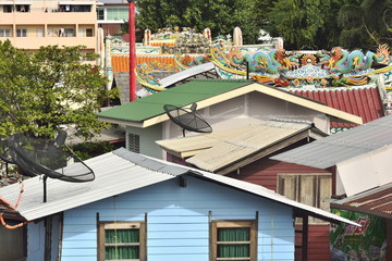Bangkok,Thailand-September 6 2015;The roof of a slum in Bangkok Thailand with a mix between a Chinese temple.