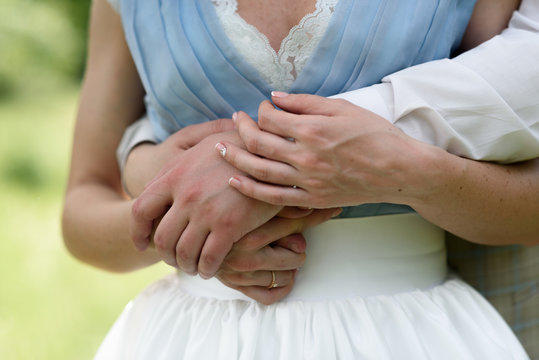 the hands of the bride and groom
