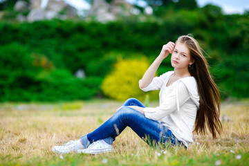 Naklejka na ściany i meble Beautiful teen girl enjoying in nature