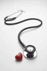 Heart and a stethoscope isolated on white background