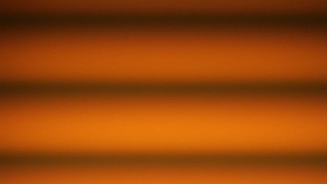 Golden yellow orange abstract loopable background. Darker horizontal lines crossing the frame creating vintage impression.