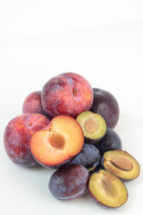 Closeup of ripe plums isolated on white.
