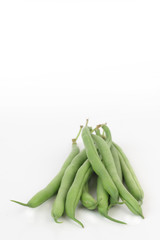 Bunch of fresh green beans isolated on white.