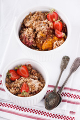 Crumble with strawberries, peach.selective focus