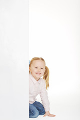 Beautiful little girl with white copy space on a white backgroun