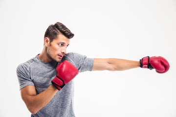 Side view portrait of a handsome man boxing