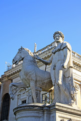 Obraz premium Statue of Castor at the Cordonata stairs on Capitoline Hill, Rome Italy