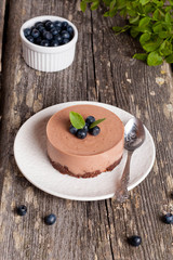 Mini-cheesecake and chocolate biscuits and blueberries