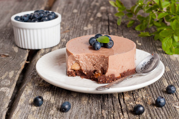 Mini-cheesecake and chocolate biscuits and blueberries