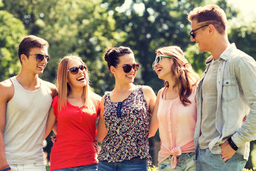 group of smiling friends outdoors