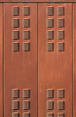 Fototapeta premium Background with rusty brown metal ventilation grille doors