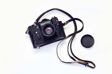 Old photo camera. Old photo camera on a white background. Camera in leather carrying case with strap, lens. Zenit.