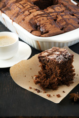 Chocolate cake with espresso on dark background