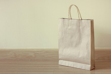 brown paper bag on the floor